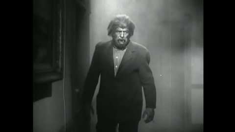 CIRCA 1942 - In this horror film, a wolfman fatally chokes the mad scientist who created him.