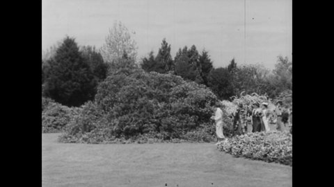 CIRCA 1933 - Azalea gardens are enjoyed in Mobile, Alabama.