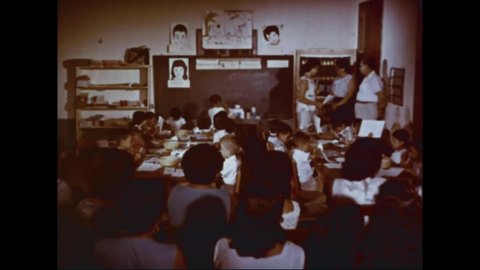 CIRCA 1960s - Students at a Guatemalan girls school do calisthenics outside.