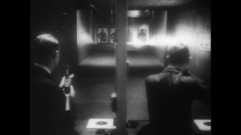 CIRCA 1936 - FBI agents use rifles and machine guns at an indoor firing range.