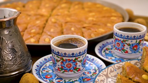 Baklava and Turkish coffee on the table. Selective focus.