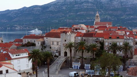 Historic Town Of Korcula, Croatia - Stone towers, houses, and buildings in the old town - aerial drone shot