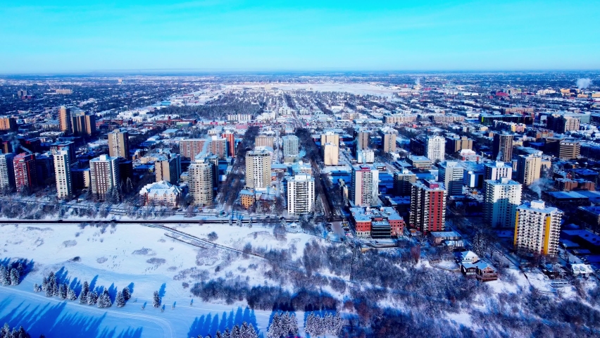 Edmonton downtown West Oliver most expensive residential neighbourhood edge of Victoria Park Road Northwest to 116 Street on a sunny winter day snow covered buildings with a skyline old homes2-2