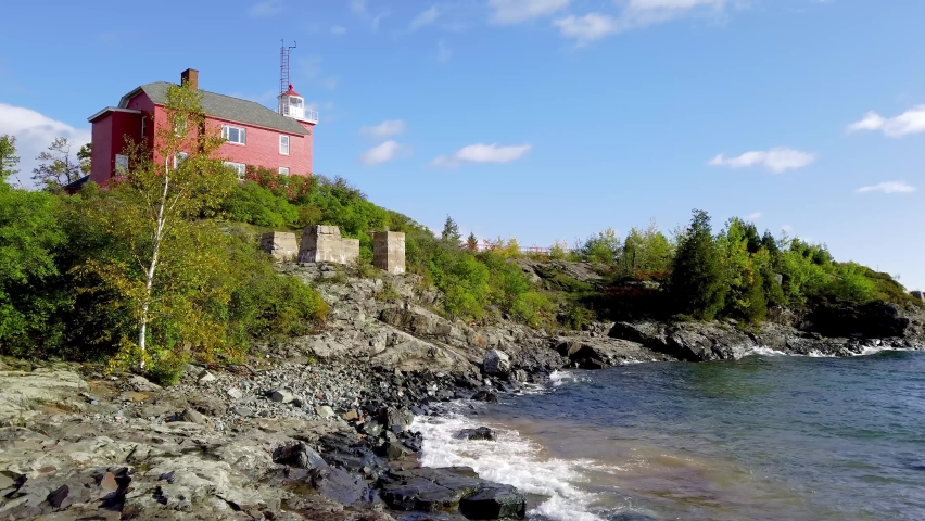 Rocky lake Superior shoreline near Marquette harbor light house in Michigan upper peninsula.