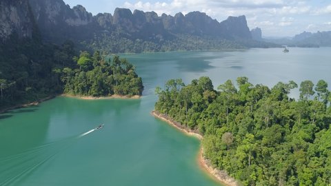 Aerial drone view of tropical Mountain peak in Thailand Beautiful archipelago islands Thailand Scenic mountains on the lake in Khao Sok National Park amazing nature landscape
