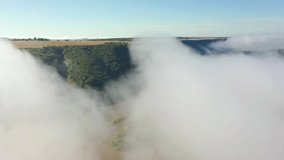 Spectacular bird's eye view of the Dniester river on a foggy morning. Location place Dnister canyon, Ukraine, Europe. Aerial footage, cinematic drone shot. Filmed UHD in 4k video. Beauty of earth.