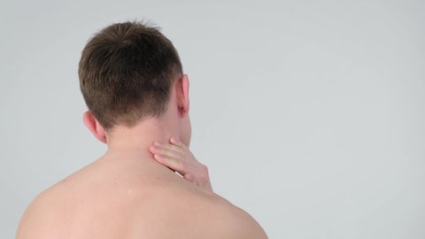 Man with neck pain over isolated background