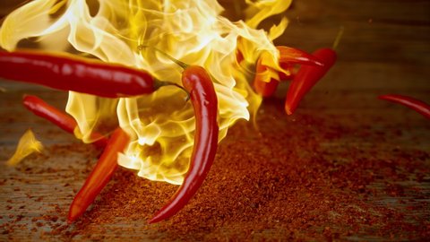 Burning Red Chili Peppers Falling into Chipotle Powder in Slow Motion 1000fps
