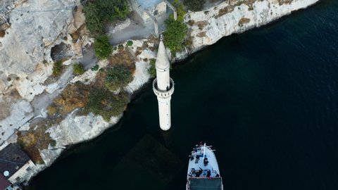 Tourists On Boat Visit The Sunken Mosque Minaret In The Old Halfeti In Sanliurfa, Turkey. - aerial