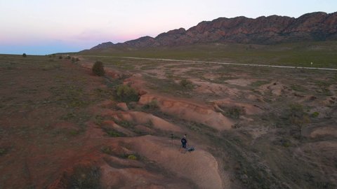 Lonely Photographer on Australian outback shooting Elders range mountain, Aerial
