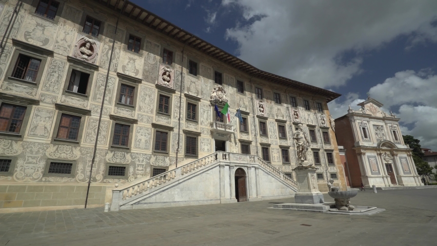View from left to right of the historical Piazza dei Cavalieri(Knights' Square) in Italy.The building is Palazzo della Carovana, presently the main building of the Scuola Normale Superiore di Pisa. Royalty-Free Stock Footage #1086058181