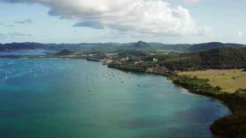 Travelling video shot in hight height of beautiful St Marin bay and turquoise sea water with blue sky in Caribbean island. Pointe de Marin for holidays vacation is idyllic
