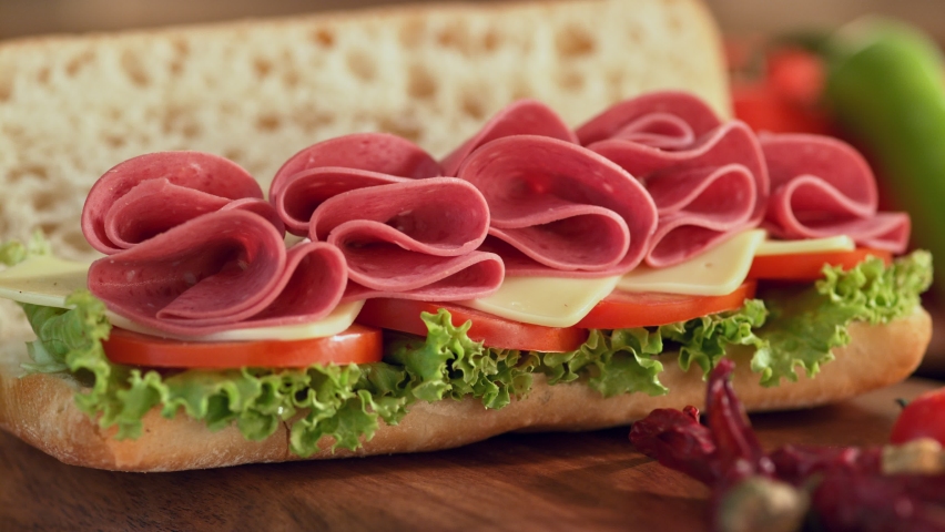 Image of delicious sandwich. A beef salami sandwich is served at the dinner table. A nice sandwich with salami is ready to eat. 