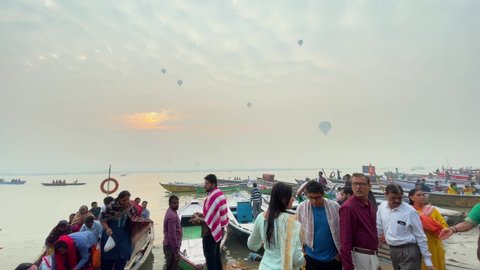Hot Air Balloon flying over the ghats of Varanasi: Varanasi, Uttar Pradesh, India - November 19 2021