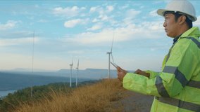 a man engineer is wearing a protective helmet on her head, using tablet Analytics engineering data... - Powered by Shutterstock - Get 15% off with code: PIKWIZARD15