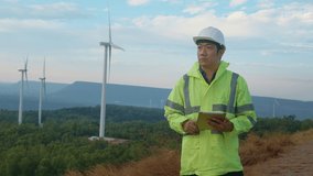 a man engineer is wearing a protective helmet on her head, using tablet Analytics engineering data... - Powered by Shutterstock - Get 15% off with code: PIKWIZARD15