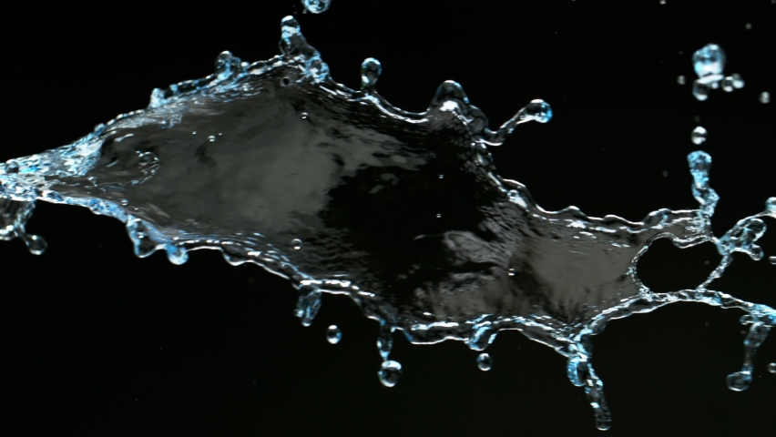 Super slow motion of splashing water isolated on black background. Filmed on high speed cinema camera, 1000 fps.