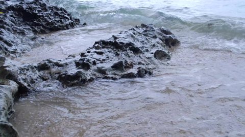 Foamy Waves Swashing On Rocky Sea Shore In The Town Of Aloguinsan In Cebu, Philippines. close up
