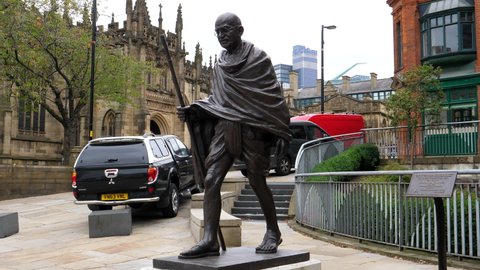 MANCHESTER, ENGLAND, UNITED KINGDOM - CIRCA SEPTEMBER, 2021: Mahatma Gandhi sculpture by Manchester city Cathedral pan.