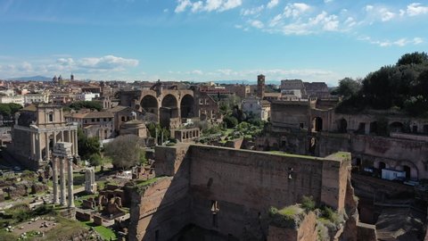 The Roman Forum and the remains of ancient Rome. Italy. 4K.
The ruins of ancient Rome, the Roman Forum, the Colosseum. Aerial shooting with drone in 4K. Colosseo