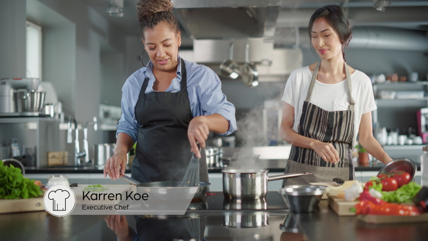 Part Three of TV Cooking Show Playback Montage in Restaurant Kitchen with Black and Asian Female Chefs. Presenter and Guest Talk, Have Fun, Show How to Cook Food. Step-by-Step Healthy Meal Preparation | Shutterstock HD Video #1086104273