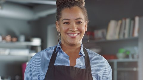 Restaurant Kitchen Chef: Portrait of Beautiful Black Lady Restoraneur, Looking at Camera, Smiling. Successful Professional Small Business Owner, Entrepreneur, Businesswoman Standing in Place of Work