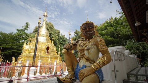 Giant Statue and Golden Pagoda in Temple of Northern Thailand,Beautiful Antique Statue with Thai History