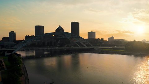 Rochester New York Rising Morning Drone Aerial. view rises up on the city skyline of Rochester New York in the morning with the sunrise