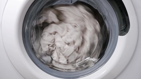Washing clothes in a washing machine. 