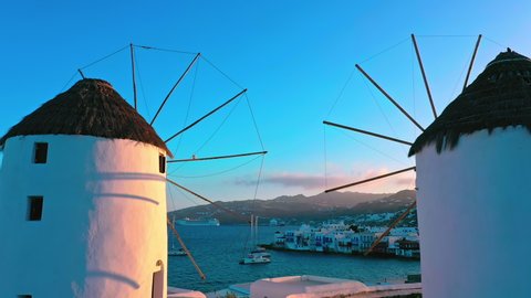 Journey landscape of greek island Mykonos. Windmills on sea coast of Greece