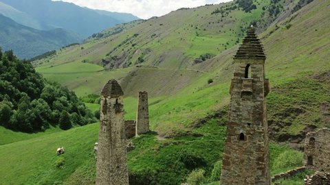 Aerial view of medieval tower complex in the mountains of Ingushetia, Russia, 4k