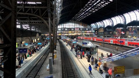 Busy Hamburg Central Station with lots of travellers - timelapse shot - CITY OF HAMBURG, GERMANY - DECEMBER 25, 2021