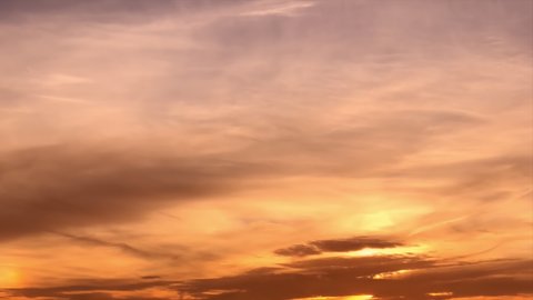 Timelapse of beautiful gold sunset sky turning to blue evening sky 4k cloudscape footage, golden clouds time lapse, beautiful cloudy motion. Beautiful pink sunset sky turning to blue evening skies. 4K