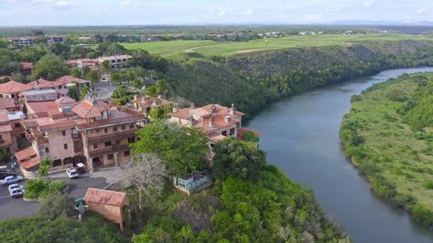 Altos de chavon in aerial shot, overlooking the golf courses and river chavon, sunny day