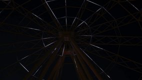 Time lapse video. Close-up view of rotating ferris wheel with illumination against black sky at night. Large observation wheel. Amusement Park. Entertainment business theme.