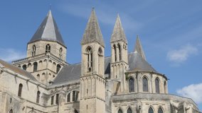 The Mens Abbey William the Conquerer church by the day in front of blue sky 4k 3840X2160 slow tilt UltraHD footage - Abbaye aux Hommes located in city of Caen of France in Normandy 4K 2160p UHD video