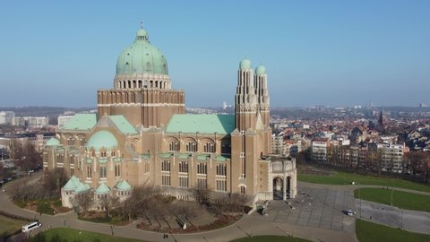 Koekelberg Brussels Belgium 25 January 2022 : Basilica of the Sacred Heart with Brussels skyline and atomium in th background. drone aerial view