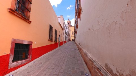 Colorful old city streets in historic city center of Zacatecas near central cathedral. It is a popular local Mexican and international tourism destination.
