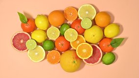 6k Fresh ripe citrus fruits filling pastel orange background. Stop motion flat lay - Powered by Shutterstock - Get 15% off with code: PIKWIZARD15