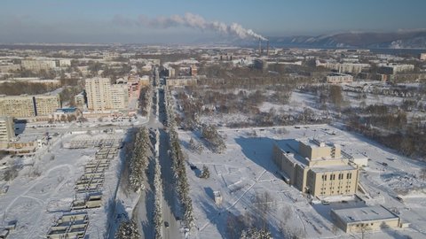 Aerial view of the Theatre near to fountains, highway, buildings and high Hill Ridge in Sunset with Long Shadows, Russia
