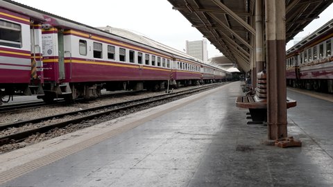 Old Railway Station Hua Lamphong, platform with traditional slow public train, passengers wagon, famous landmark for tourist. Perspective view, dolly move 10bit, 422. Bangkok, Thailand Dec 2 2021