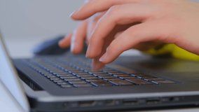 Hands typing on keyboard. Freelancer woman writing text on laptop computer in closeup 4k video. Professional writer female using modern notebook pc for distant work