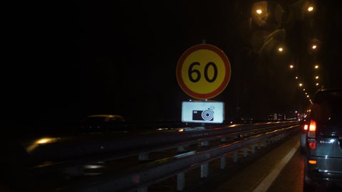 Speed limit road sign on the highway at night
