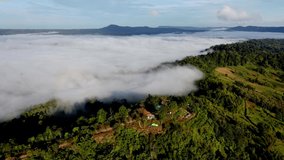 4K video footage of Aerial view from drone of sea of clouds in the morning over the mountains hills,
country road,farmland and rural area.
Foggy and cloud inversion over the mountains.