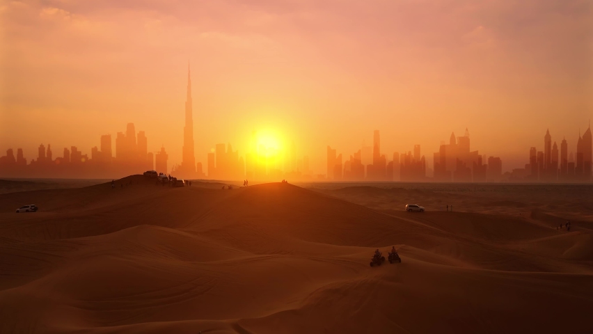 Aerial. Drone view of tourists looks on the sunset and Dubai city silhouette at the desert and epic sun. | Shutterstock HD Video #1086191270