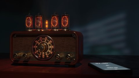 A vintage alarm clock on Nixie tubes with a radio and a smartphone wake up    at 7 am. Close-up. At 7:00, the radio turns on, its dial lights up, and the alarm goes off on the phone. Antique and modern.