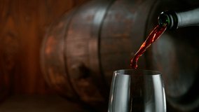 Super slow motion of pouring red wine into glass with camera motion. Filmed on high speed cinema camera, 1000 fps - Powered by Shutterstock - Get 15% off with code: PIKWIZARD15