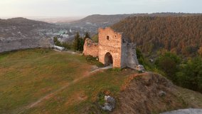Ancient ruins of Kremenets Castle on a hill from a bird's eye view. Location place Ukraine, Europe. Aerial footage, cinematic drone shot. Filmed in UHD 4k video. Discover the beauty of earth.