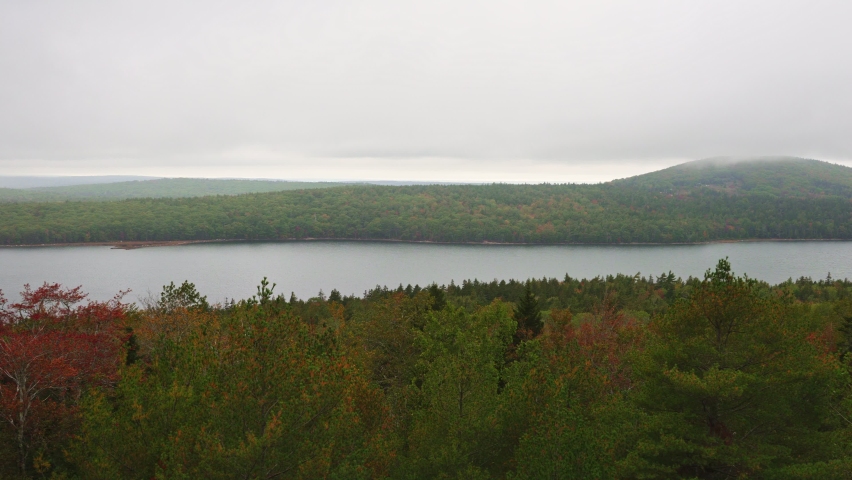 Fall colors on the shores of Long Pond in Acadia National Park in Maine