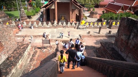 Ayutthaya, Thailand - 20 Sep 2021 : Tourists are traveling in ancient ruin of Ayutthaya, Thailand.